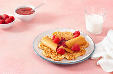 waffles with Norwegian brunost traditional brown cheese and raspberry jamの写真素材