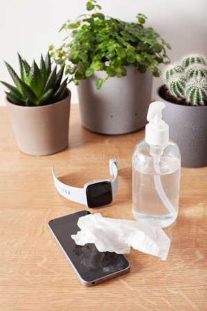 disinfecting smart watch and smartphone, eliminating germs bacteriaの写真素材