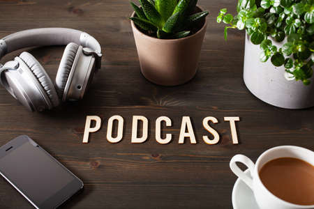 podcast word text concept modern wireless headphones smartphoneの写真素材