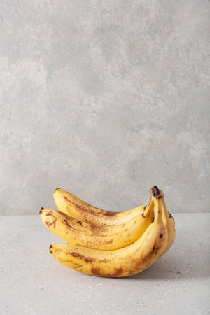ripe overripe organic bananas on concrete background. ugly food zero waste conceptの写真素材