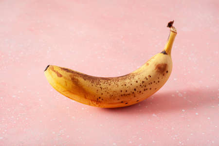 ripe overripe organic bananas on concrete background. ugly food zero waste conceptの写真素材