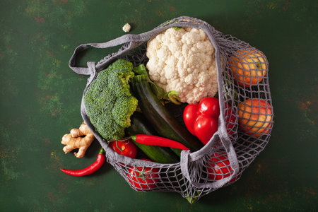 fruits vegetables in reusable mesh cotton bag, plastic free zero waste conceptの写真素材