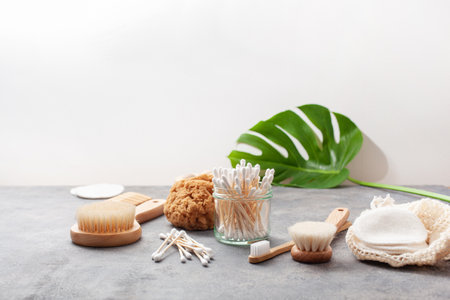 zero waste eco friendly hygiene bathroom concept. wooden toothbrush reusable pads wood buds brushの写真素材