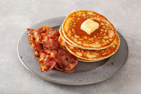 sweet pancakes with butter and bacon. traditional american breakfastの写真素材