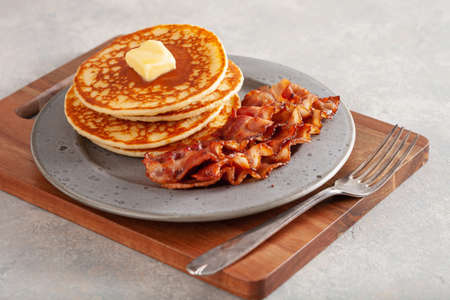 sweet pancakes with butter and bacon. traditional american breakfastの写真素材