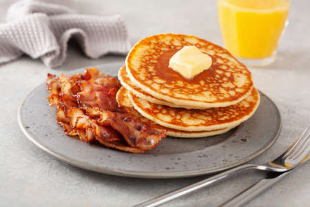 sweet pancakes with butter and bacon. traditional american breakfastの写真素材