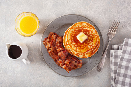 sweet pancakes with butter and bacon. traditional american breakfastの写真素材