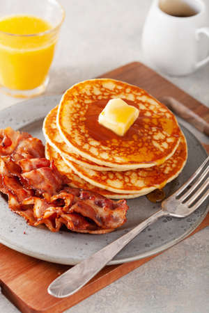 sweet pancakes with butter and bacon. traditional american breakfastの写真素材