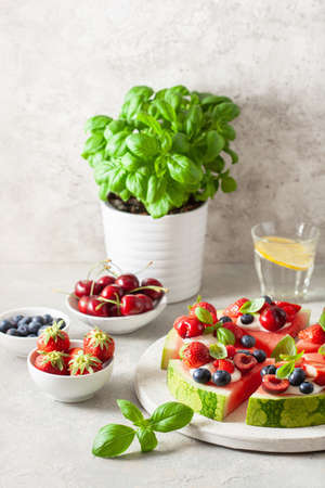 watermelon pizza slices with yogurt and berries, summer dessertの写真素材
