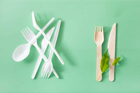 harmful plastic and eco friendly wooden cutlery. plastic free conceptの写真素材