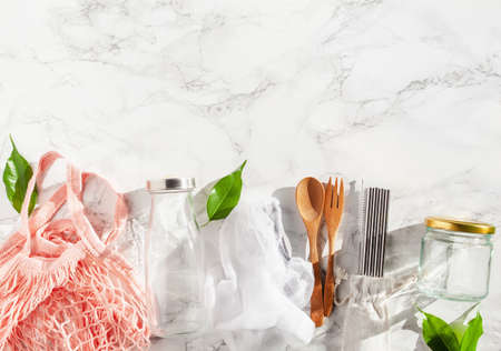 zero waste eco friendly concept. reusable cotton bag, stainless steel drinking staw, glass jar, wooden cutleryの写真素材