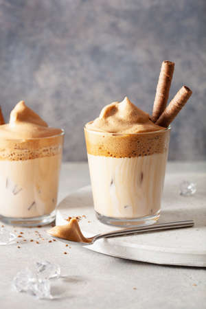 dalgona coffee in glass. trendy Instant coffee whipped with sugar and hot waterの写真素材