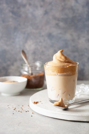 dalgona coffee in glass. trendy Instant coffee whipped with sugar and hot waterの写真素材