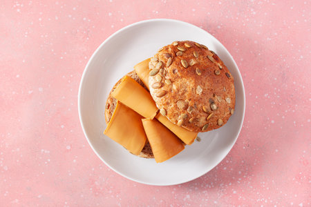 fresh bun with Norwegian brunost traditional brown cheeseの写真素材