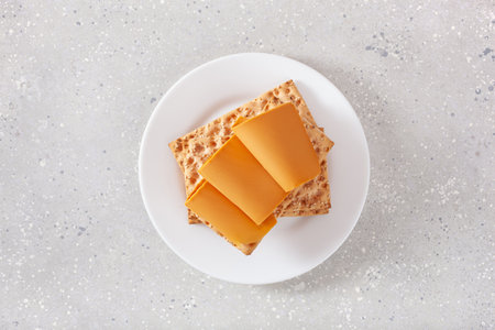 crispbread with Norwegian brunost traditional brown cheeseの写真素材