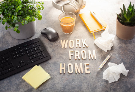 work from home text desk with keyboard computer smartphone notebook houseplants, workspace office at homeの写真素材