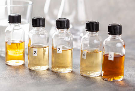 tasting whisky bottles and glasses or spirit brandy cognac. tasting at homeの写真素材