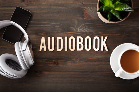 audiobook word text concept modern wireless headphones smartphoneの写真素材