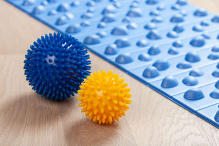 massage rubber balls, mat for self massage and reflexologyの写真素材