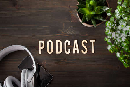 podcast word text concept modern wireless headphones smartphoneの写真素材