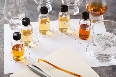 tasting whisky bottles and glasses or spirit brandy cognac. tasting at homeの写真素材