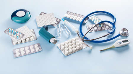 pills stethoscope syringe asthma inhaler medicine. emergency medical treatmentの写真素材
