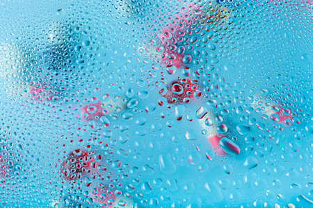 pill tablet capsule medicine through water drops backgroundの写真素材