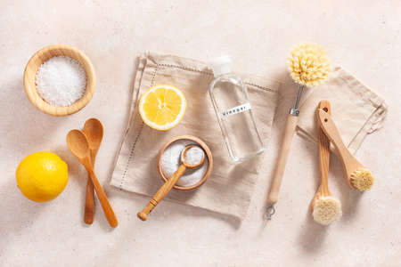 zero waste eco friendly cleaning concept. wooden brushes, lemon, baking soda, vinegarの写真素材