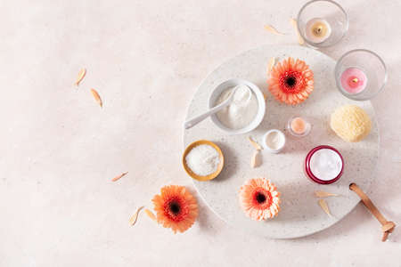 skincare products and daisy flowers. natural cosmetics for home spa treatmentの写真素材