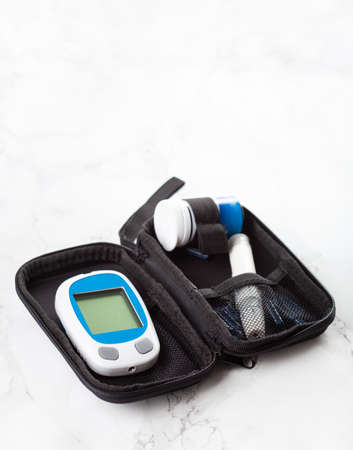 glucometer ketometer lancet and strips for self-monitoring of blood glucose or ketones level. diabetes or keto dietの写真素材