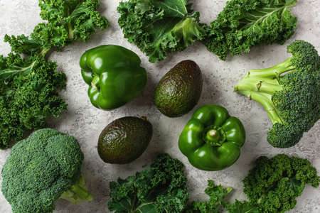 assorted green vegetables bell peppers, kale avocado, broccoliの写真素材