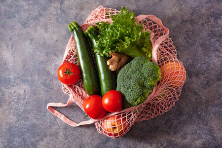 fruits vegetables in reusable mesh cotton bag, plastic free zero waste conceptの写真素材