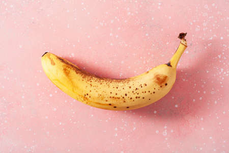 ripe overripe organic bananas on concrete background. ugly food zero waste conceptの写真素材