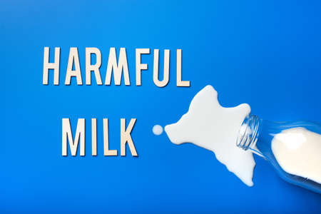 harmful milk word text letters lactose intolerance allergy. milk splatter. avoid dangerous dairyの写真素材