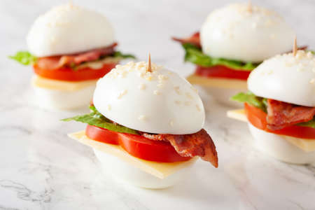 blt egg sandwich with cheese bacon lettuce. healthy keto low carb dietの写真素材