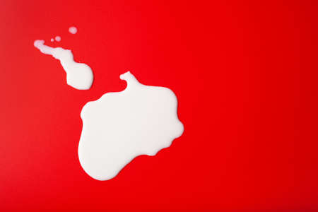 bad milk lactose intolerance allergy. milk splatter. avoid dangerous dairyの写真素材