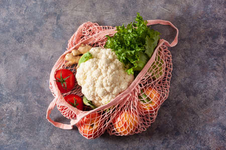 fruits vegetables in reusable mesh cotton bag, plastic free zero waste conceptの写真素材
