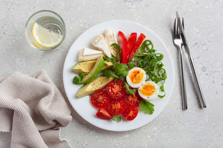 keto diet breakfast egg avocado brie cheese tomato bell pepperの写真素材