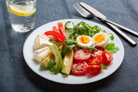 keto diet breakfast egg avocado brie cheese tomato bell pepperの写真素材