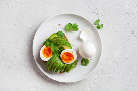 breakfast avocado sandwich with boiled eggの写真素材