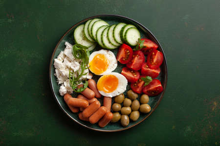healthy keto diet breakfast lunch egg feta cheese tomato sausage oliveの写真素材