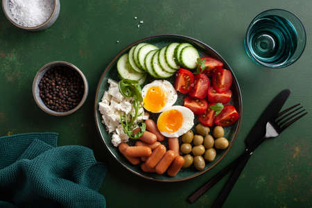 healthy keto diet breakfast lunch egg feta cheese tomato sausage oliveの写真素材