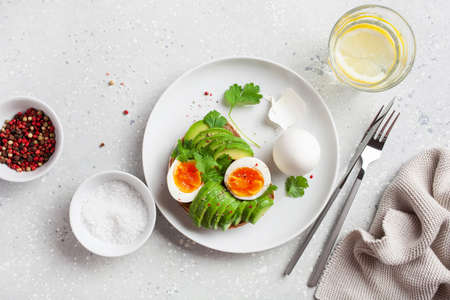 breakfast avocado sandwich with boiled eggの写真素材