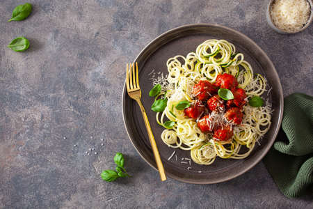 keto paleo diet zoodles spiralized zucchini noodles with meatballs and parmesanの写真素材