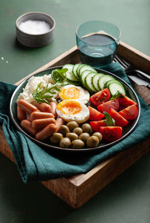 healthy keto diet breakfast lunch egg feta cheese tomato sausage oliveの写真素材