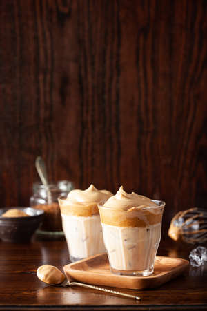 dalgona coffee in glass. trendy Instant coffee whipped with sugar and hot waterの写真素材