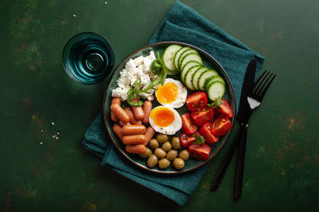 healthy keto diet breakfast lunch egg feta cheese tomato sausage oliveの写真素材