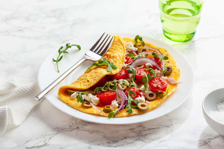 omelette with tomato, feta cheese onion and arugula. healthy keto diet low carb breakfastの写真素材