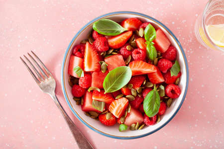 watermelon salad with strawberry raspberry basil seeds. healthy summer dessertの写真素材
