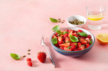 watermelon salad with strawberry raspberry basil seeds. healthy summer dessertの写真素材